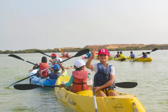 kids enjoying kayaking in qatar